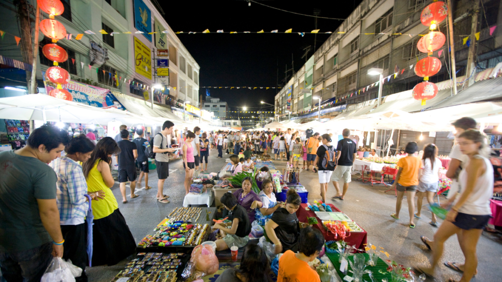 Shoppers and vendors on a lively street scene at the Krabi Night Market